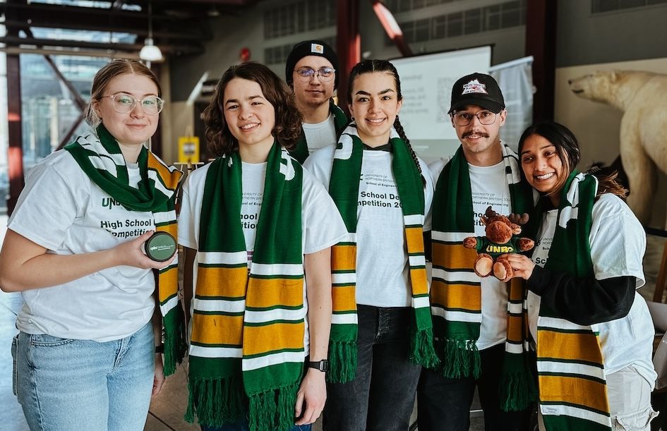 Group photo of School of Engineering students, sporting UNBC swag.