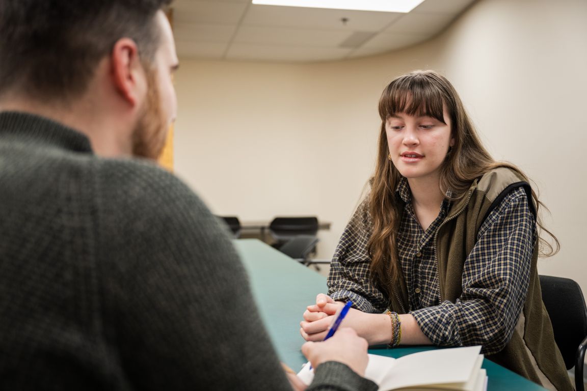 UNBC staff and student having discussion