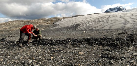 Researchers working on a glacier field