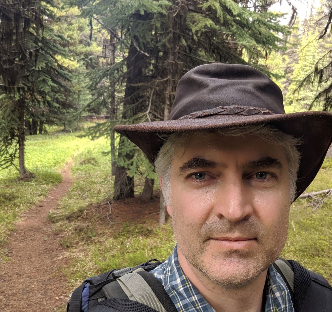 Dr. Cole Burton in forest setting