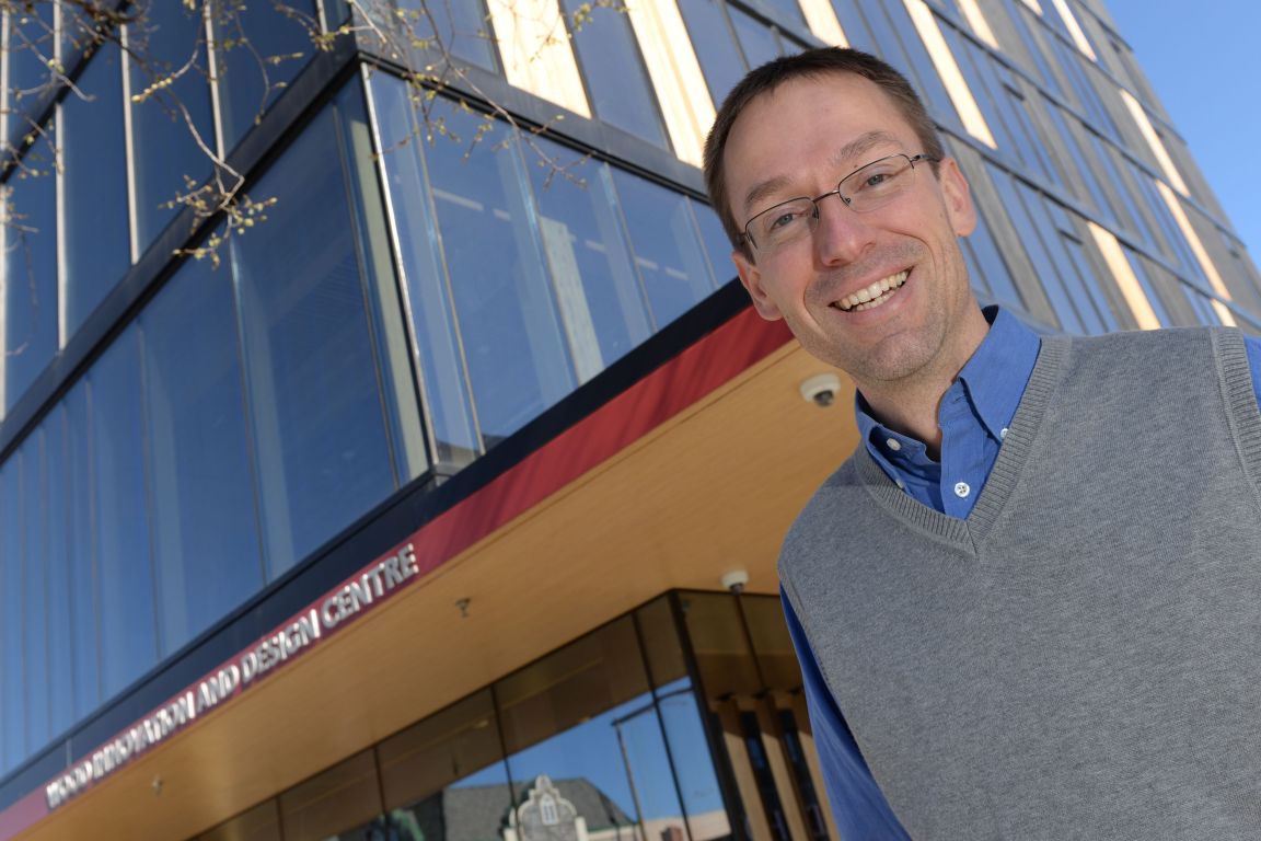 Dr. Thomas Tannert standing in front of the Wood Innovation Design Centre