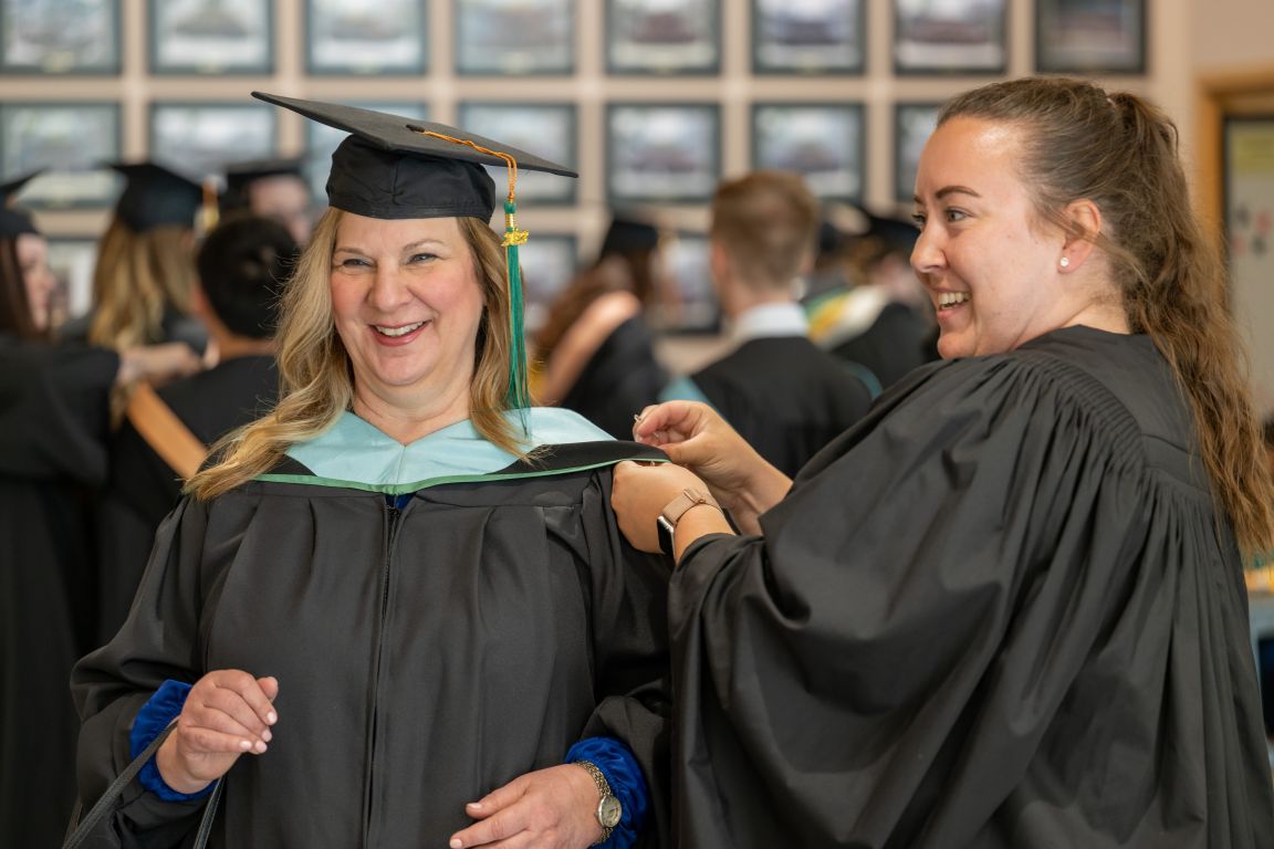 Female grad at hooding station