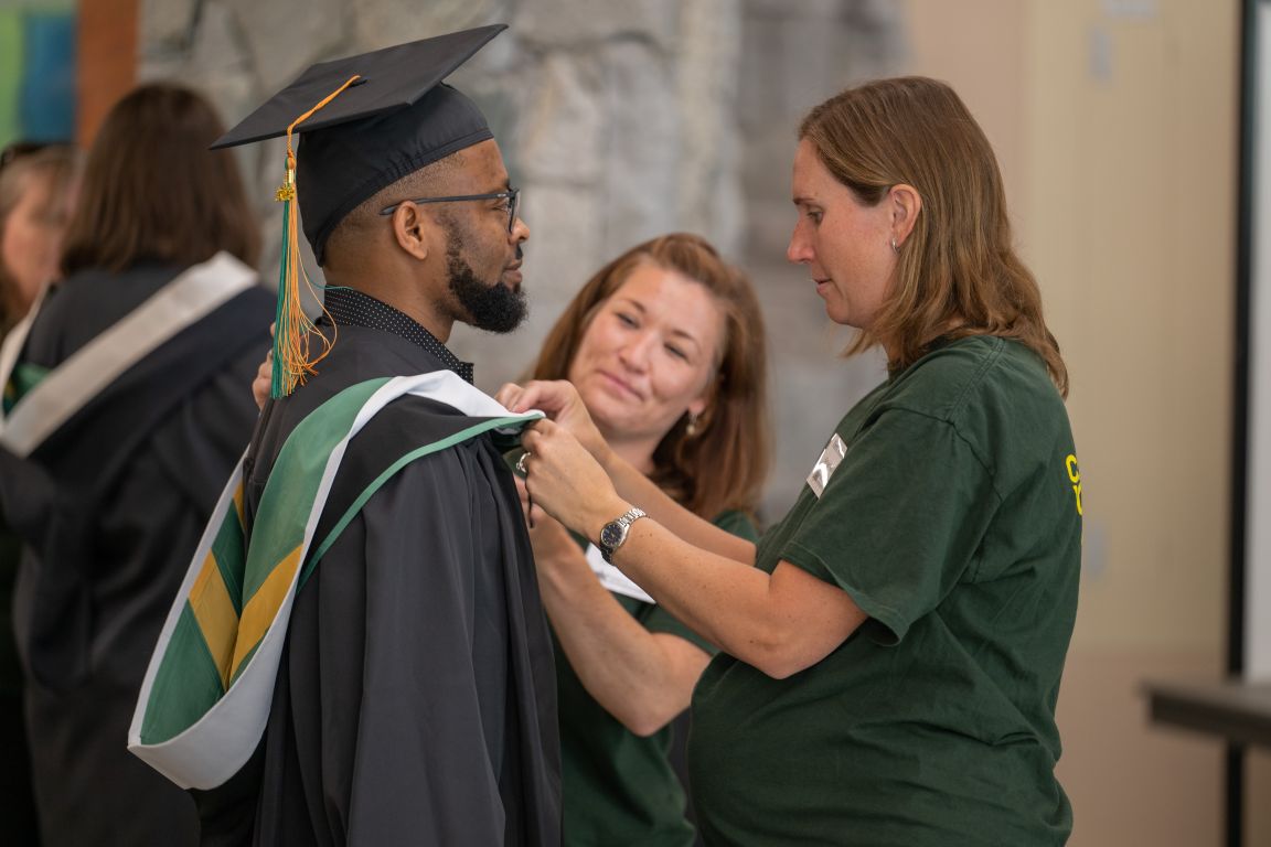 Male grad (2) at hooding station