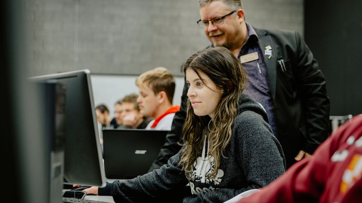 Professor and students in a lab