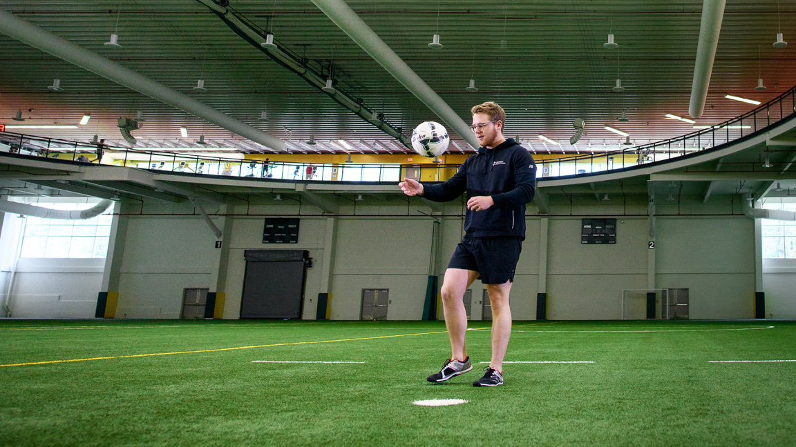 UNBC student playing soccer at Northern Sport Centre