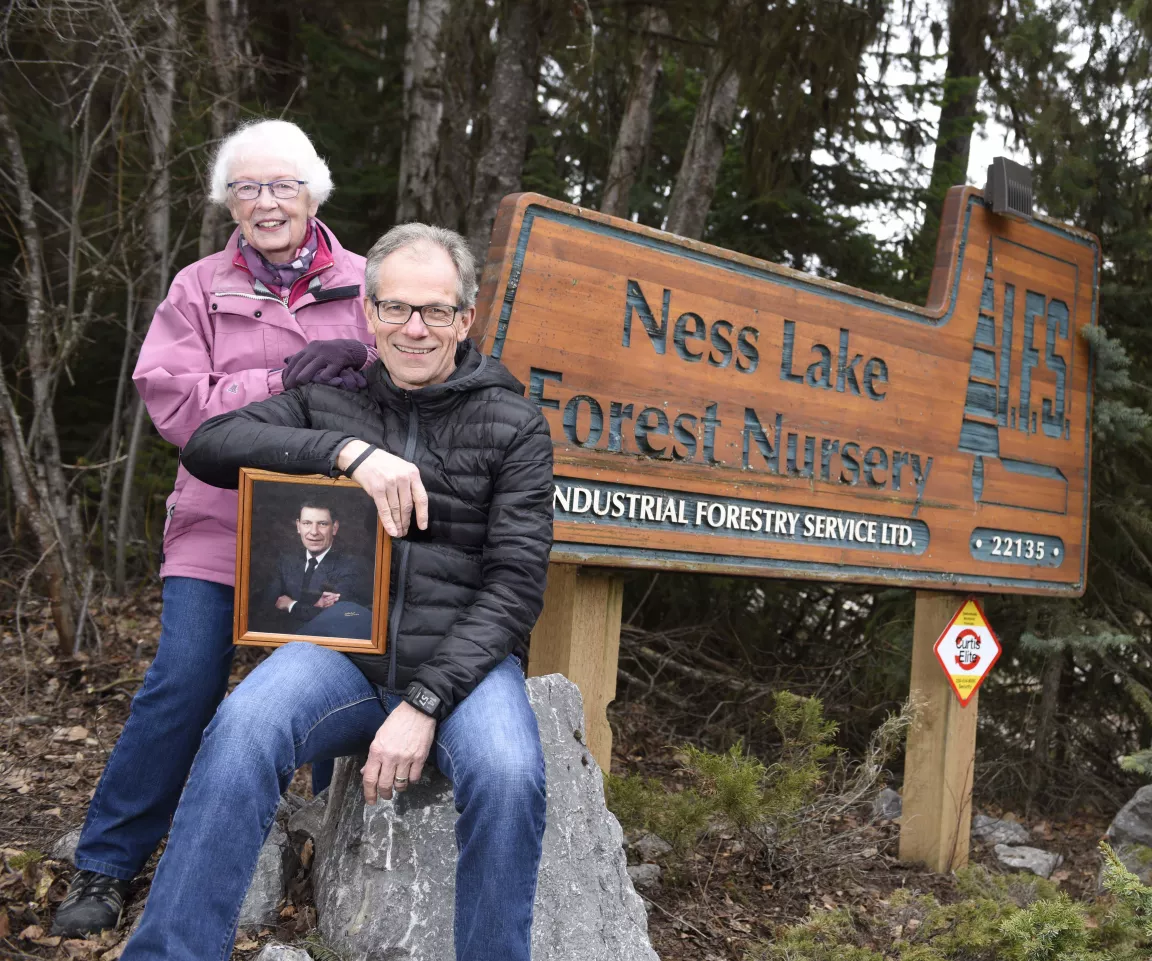 Marjorie and Tim Nevison hold a photo of the late Alan Nevison 