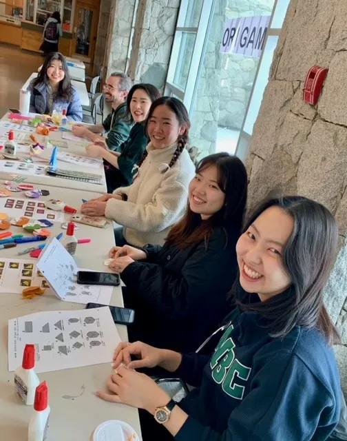 A group of students folding origami