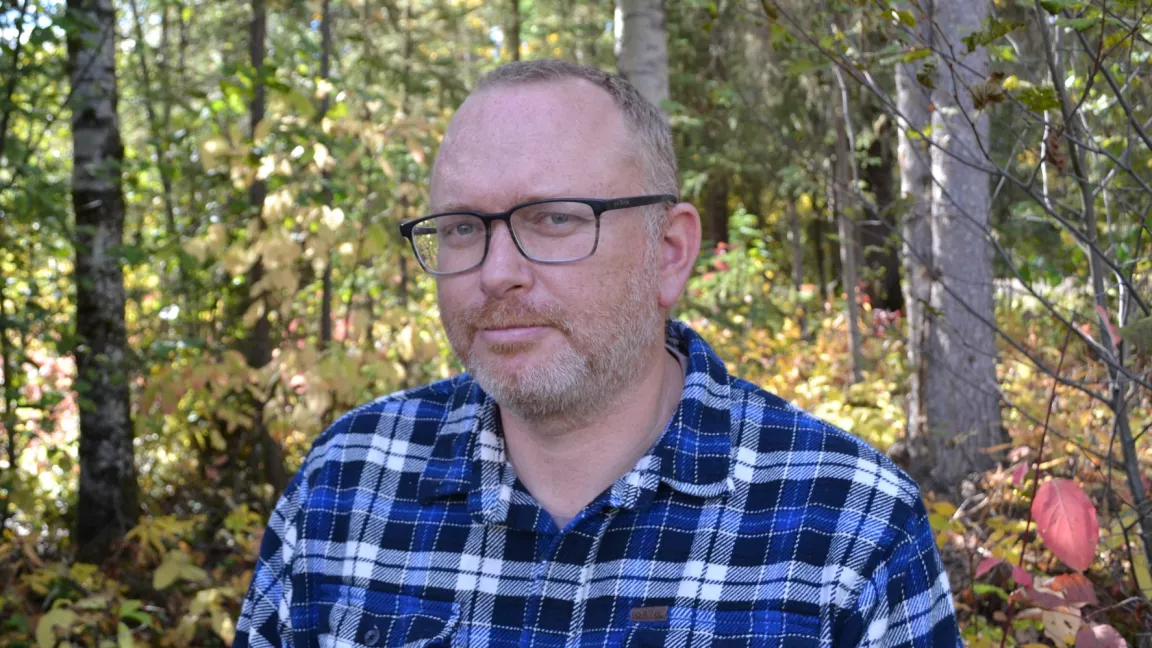 Dr. Daniel Erasmus in a forest setting 