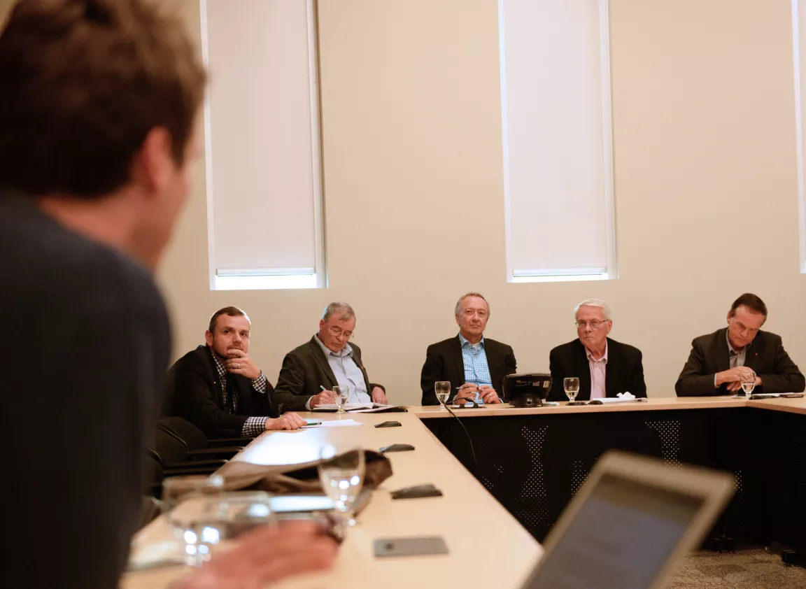 Senators listen to a question at UNBC event.