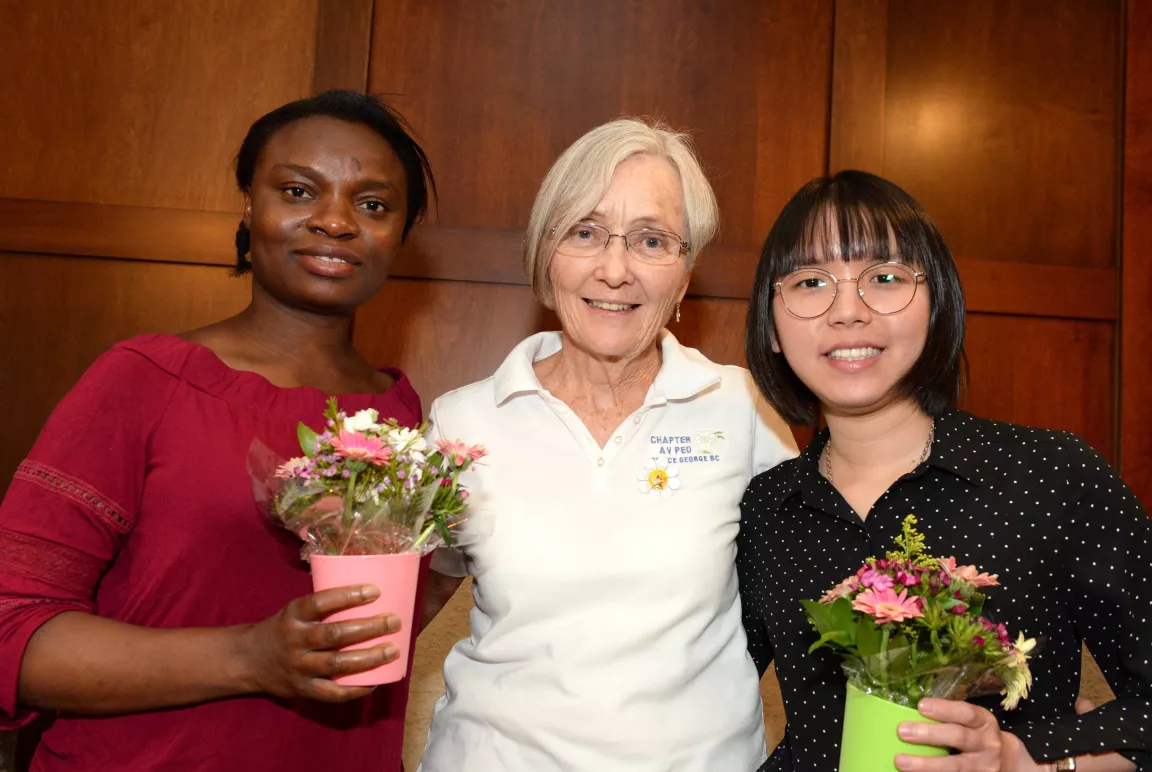 From left: UNBC PhD student Christiana Onabola, Prince George P.E.O. Chapter President Beth Quesnel and UNBC PhD student Hooi Xian Lee.