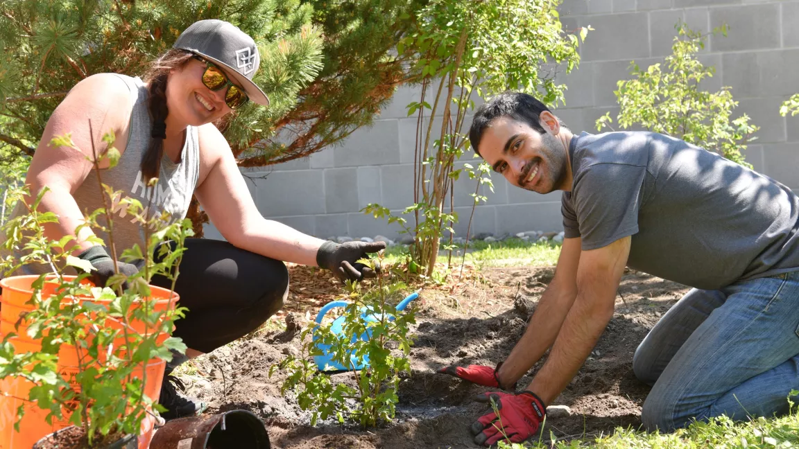 students planting in the Wabooz Garden