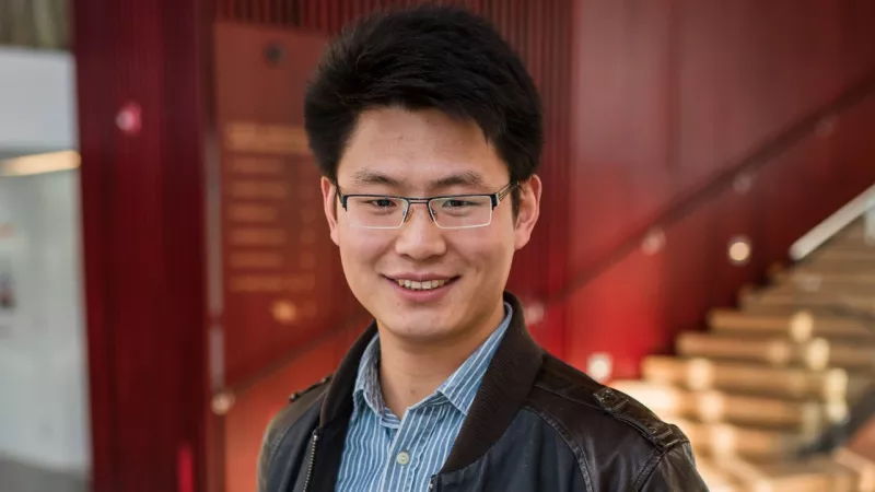 Dr. Jianhui Zhou in the lobby of the wood innovation and design centre