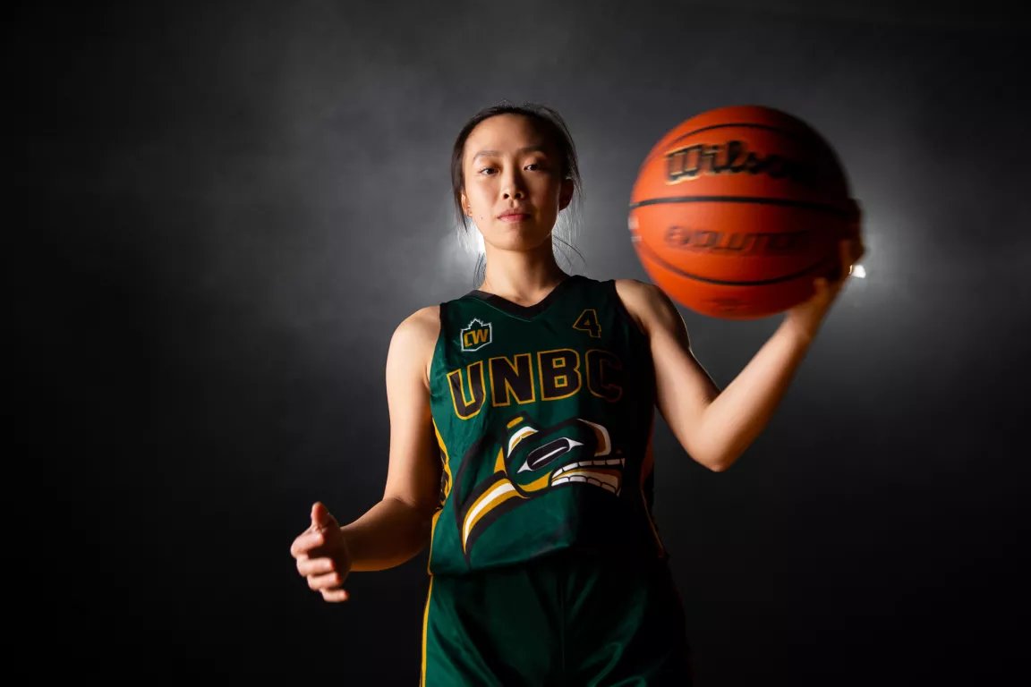 A UNBC women's basketball player wears the Timberwolves alternate jersey.