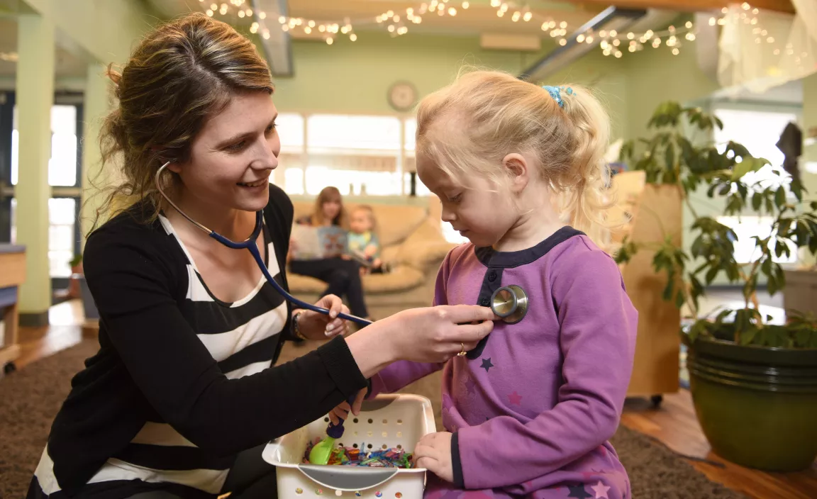 Nurse practitioner student Kristine Rowswell interacts with a child at daycare