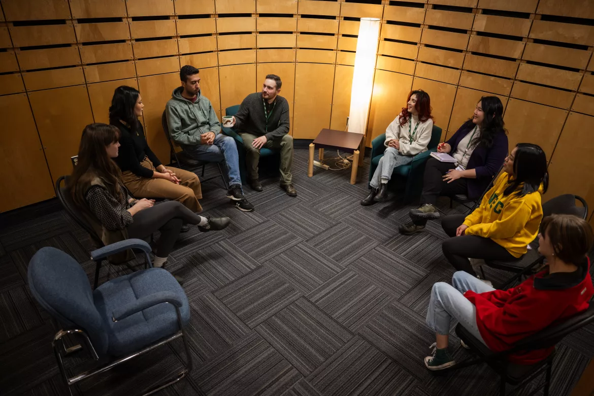 Group of UNBC students and staff sitting in restorative circle