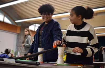 Two students participate in a youth program activity.