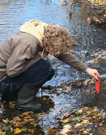 Stream sampling in Nahounli Creek, Fort St. James