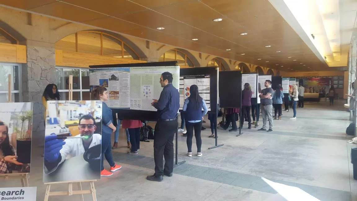 Event participants looking at poster presentations