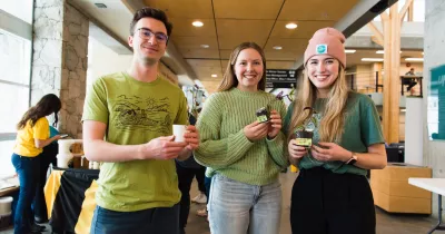 Students holding plants