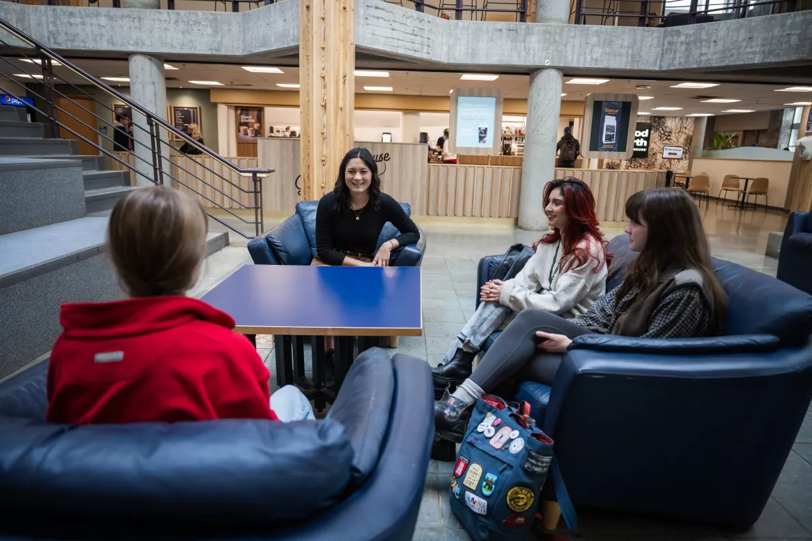 UNBC students sitting in Winter Garden on campus