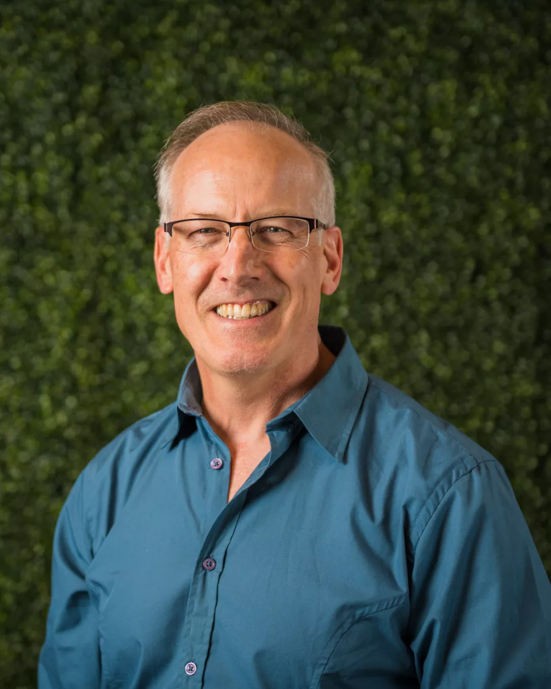 Profile photo of man wearing turquoise shirt